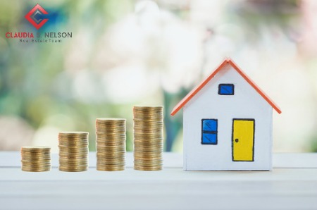 tiny-house-beside-gold-coins